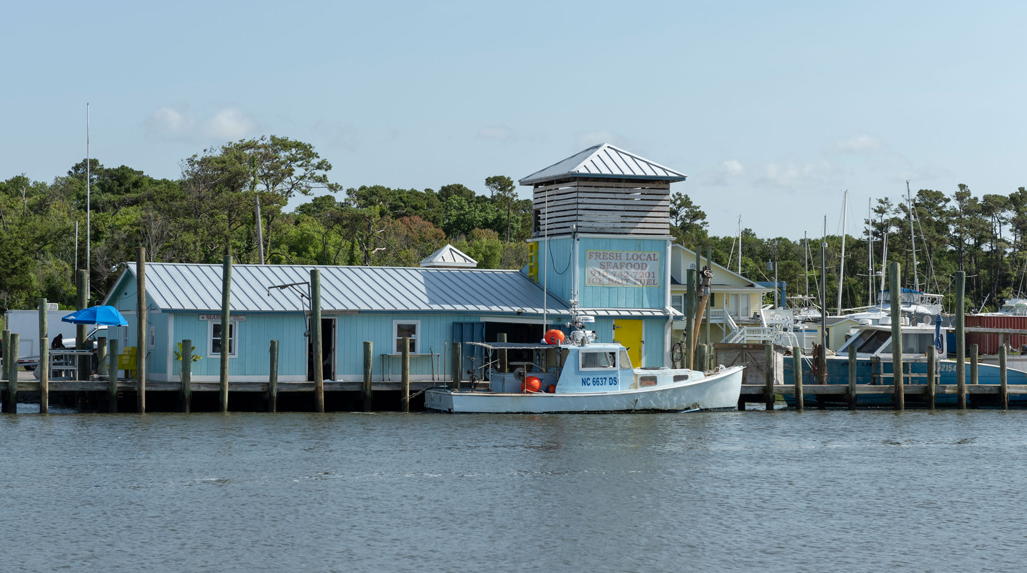 Fresh Local Seafood building on waterway